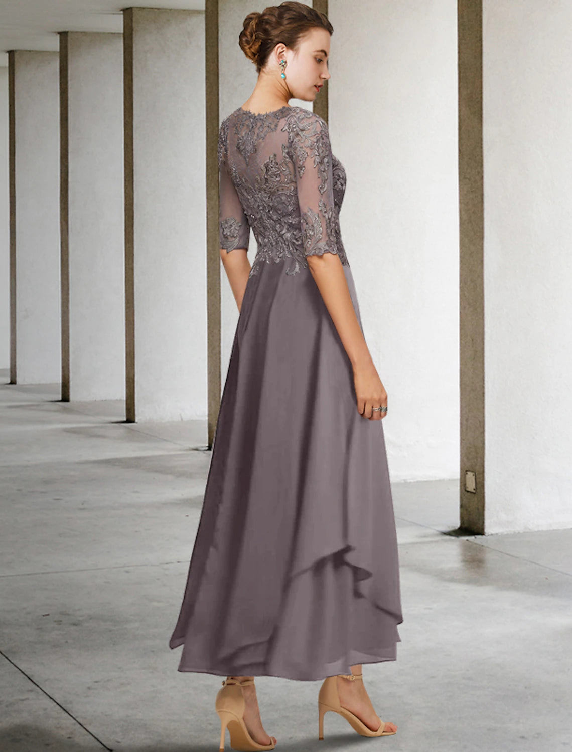 Back view of the elegant A-line Mother of the Bride dress, showcasing its formal design.