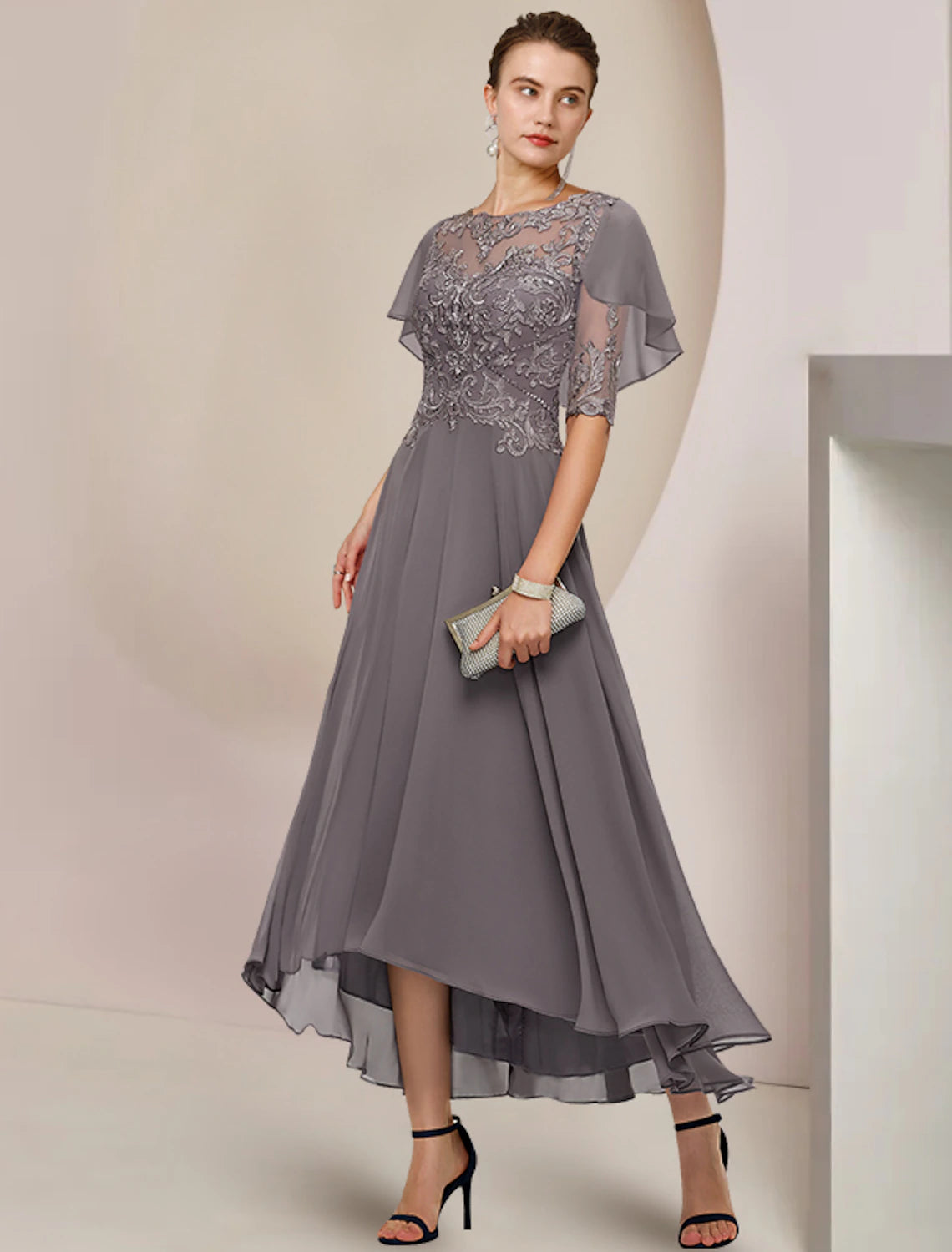 Elegant A-line tea length dress with scoop neck and half sleeves.