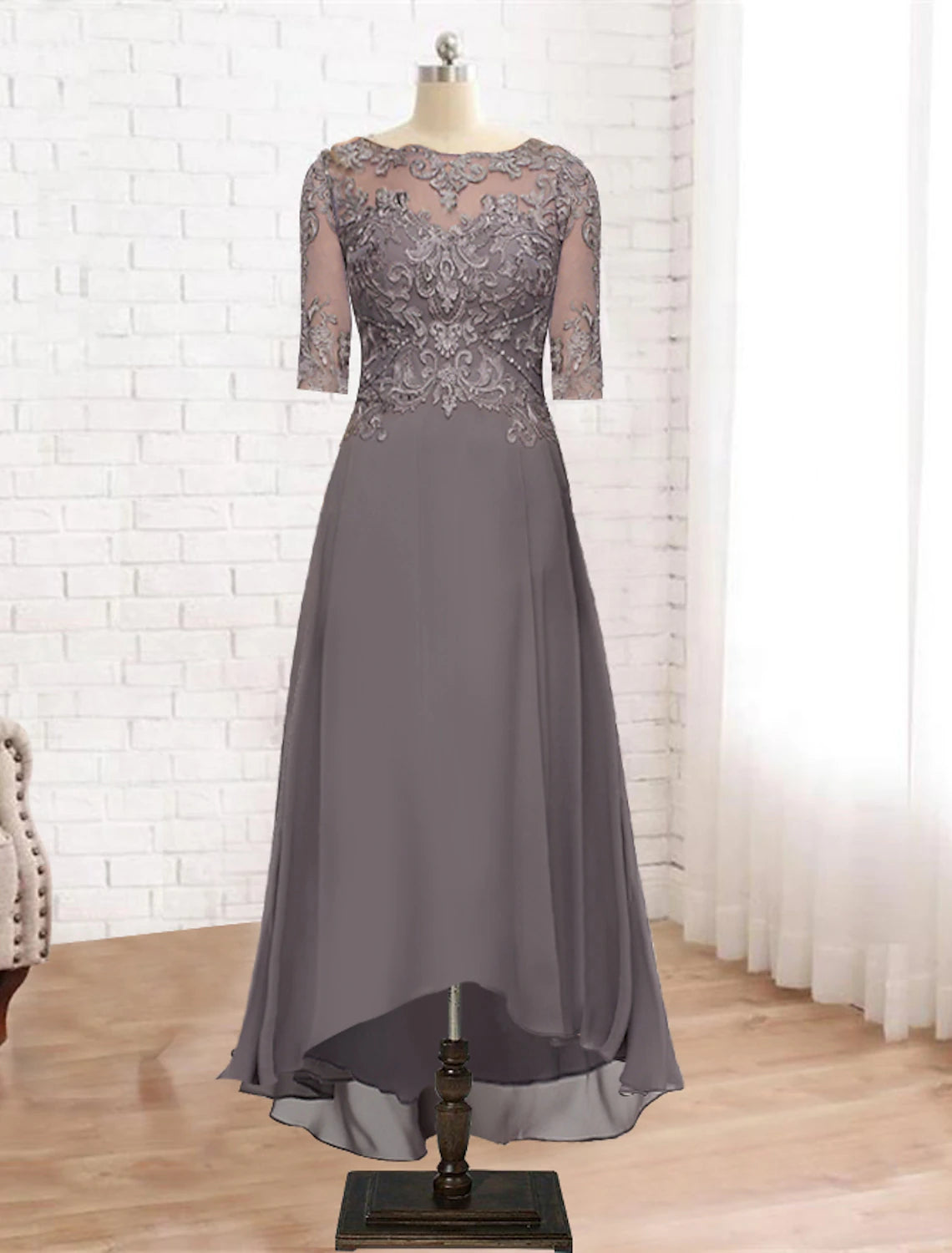 Elegant A-Line Mother of the Bride dress with scoop neck, half sleeves, and high-low tea length hem.