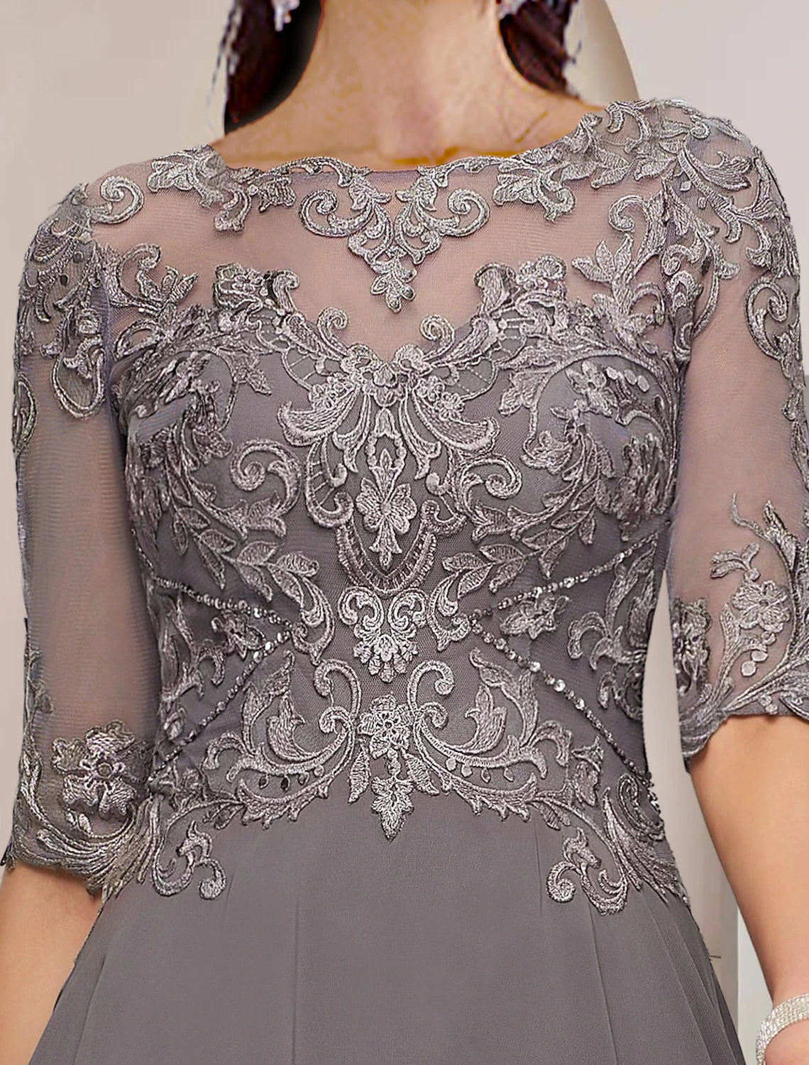 Side view of the A-Line chiffon lace dress, showing pleats and asymmetrical hem.