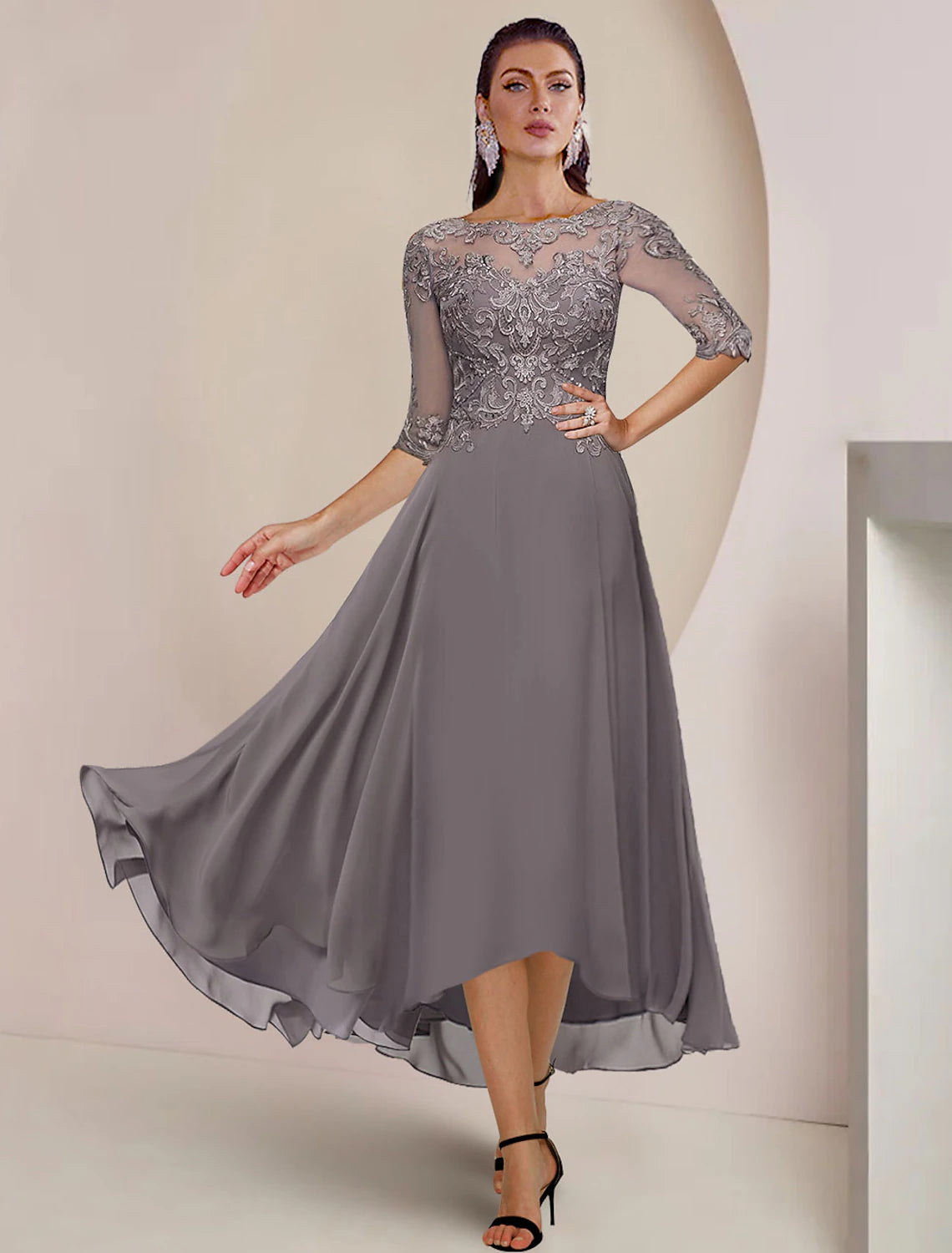 Formal high-low tea length dress with elegant half sleeves and scoop neckline.