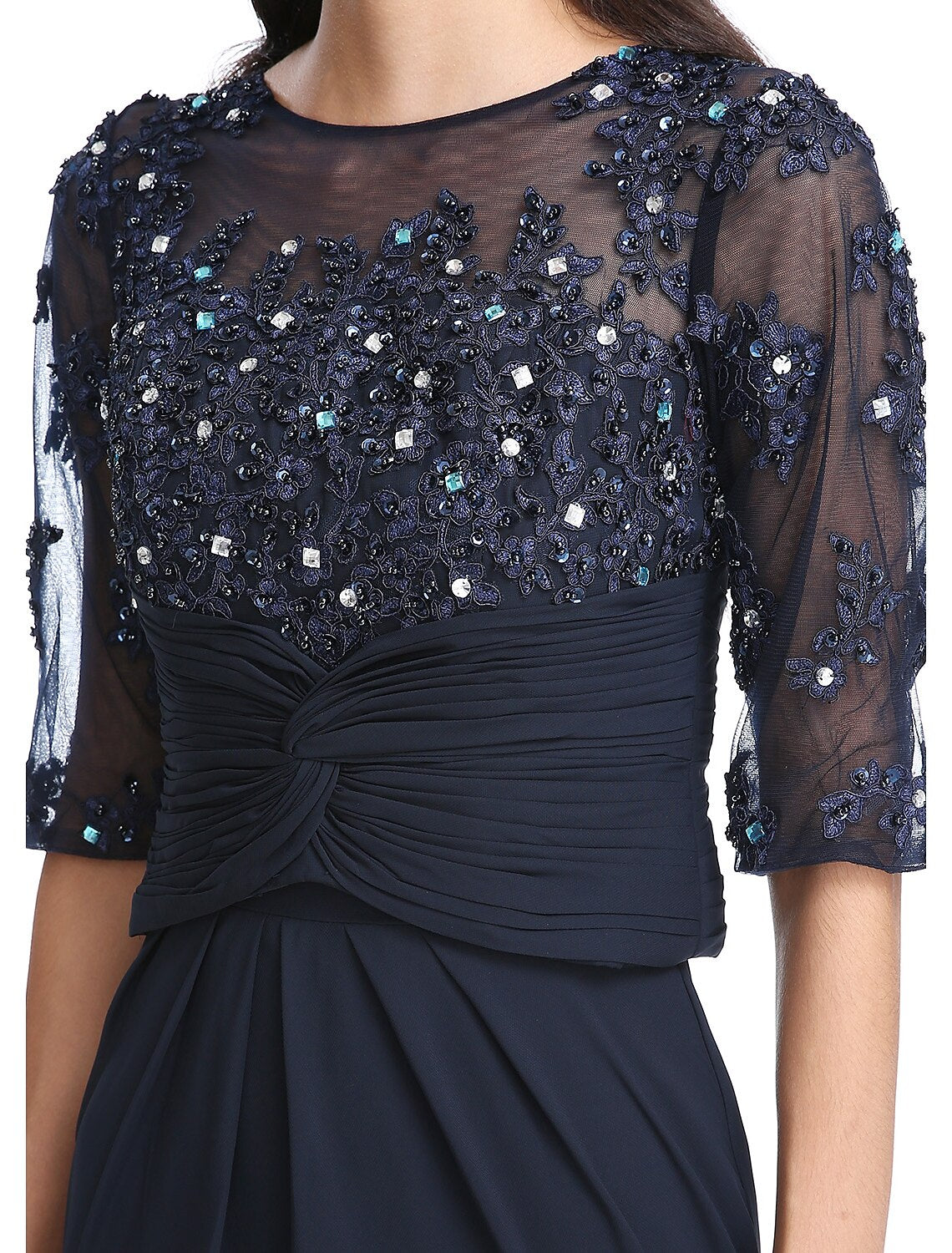 Detail of appliques on the elegant chiffon gown.