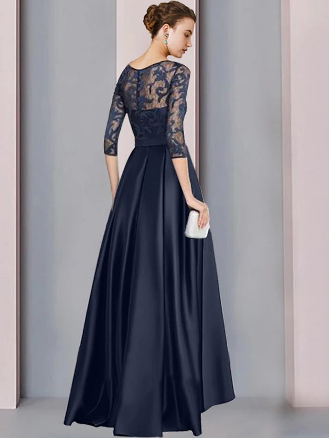Back view of the A-line high-low mother of the bride dress, showing pleats and bow detail.
