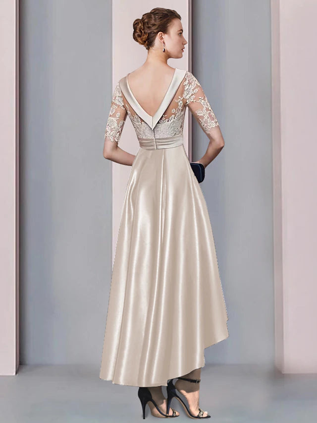 Model wearing a flowing A-Line high-low tea length dress for a wedding.