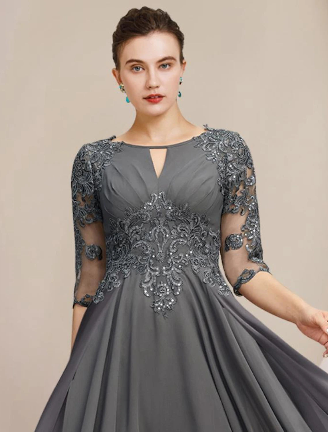 Side view of the A-line high-low tea length dress, featuring lace and sequin details.
