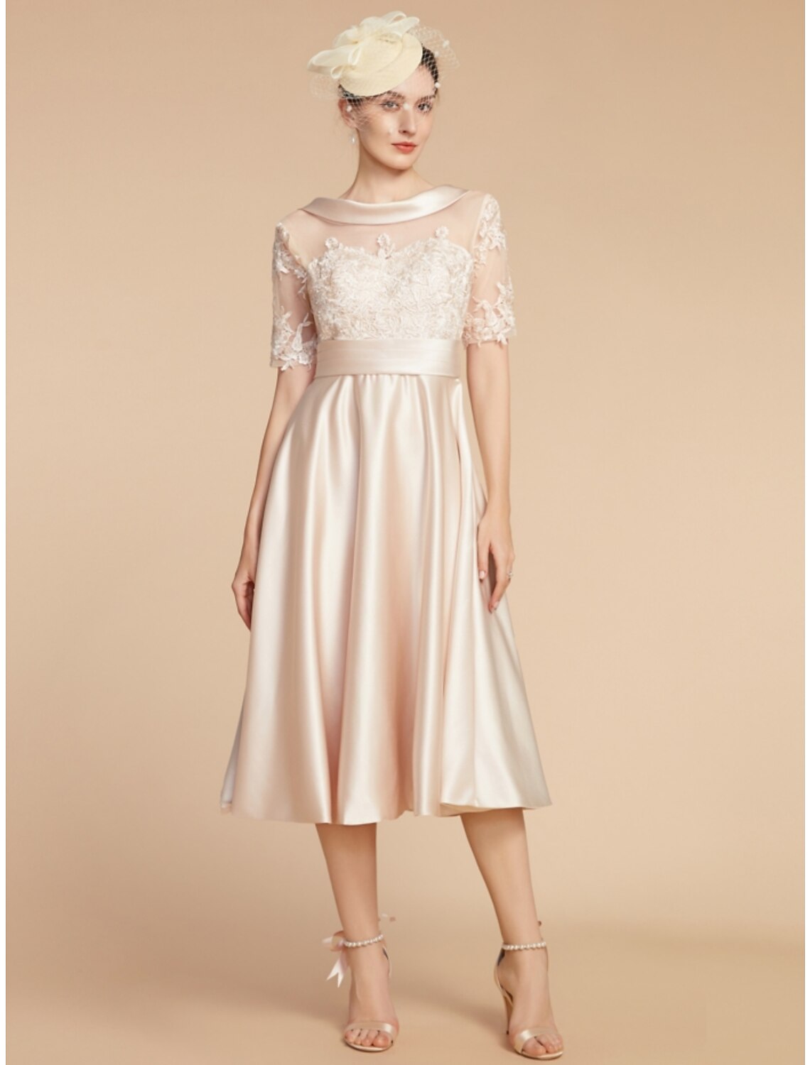 Front view of an elegant A-line knee-length dress with half sleeves and a scoop neck.