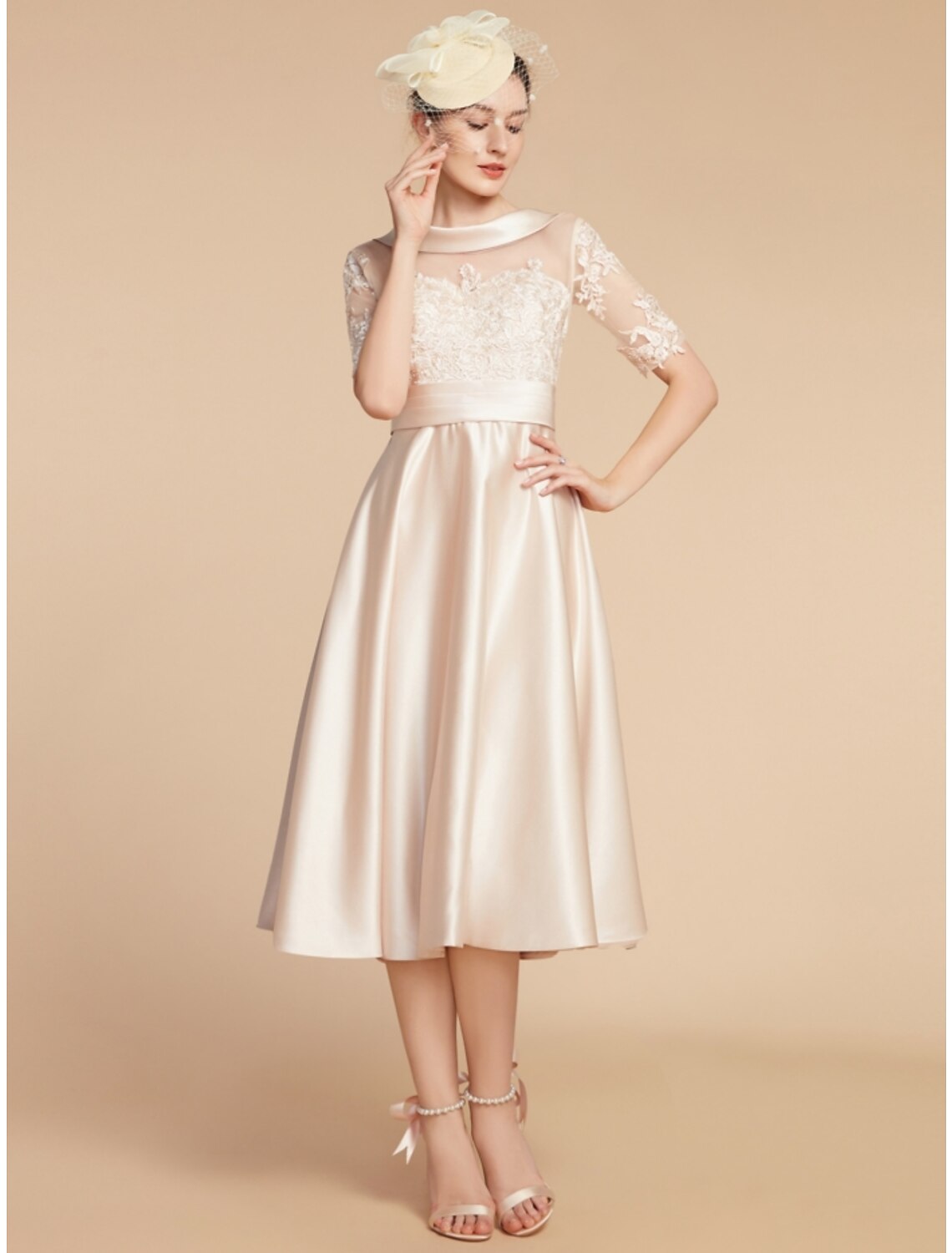 Side view of an elegant A-line knee-length dress with half sleeves and a scoop neck.