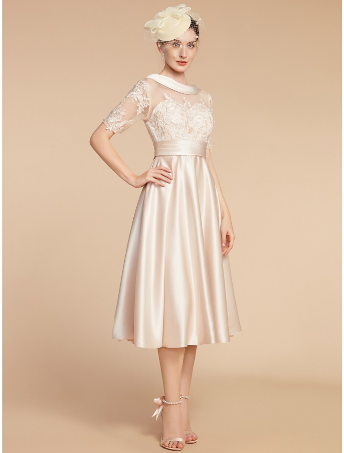 Back view of an elegant A-line knee-length dress with half sleeves and a scoop neck.