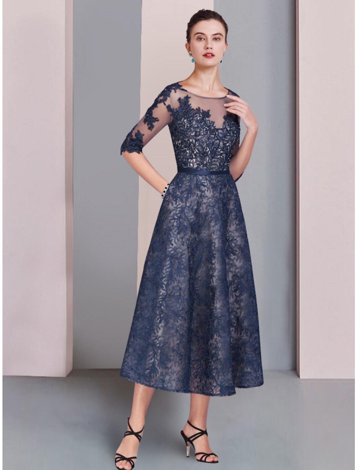 Elegant A-Line Mother of the Bride dress with scoop neck and lace half sleeves.