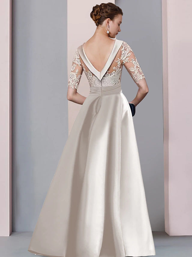 Side view of the A-Line Mother of the Bride dress, highlighting the floor-length skirt and split front detail.