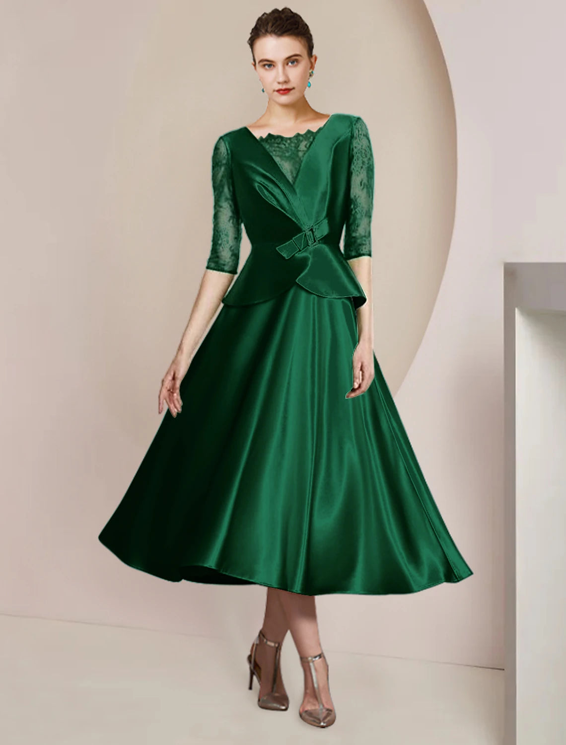 Elegant A-Line Mother of the Bride dress in satin lace with scoop neck, half sleeves, and tea length.