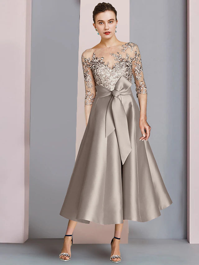 Elegant A-Line Mother of the Bride dress with scoop neck, half sleeves, and bow appliques.