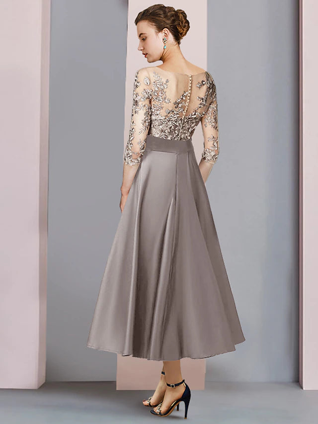 Back view of the A-Line tea length dress, showing satin lace detail.
