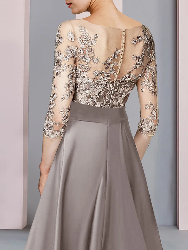 Close-up of the satin lace fabric and bow applique on the dress sleeve.