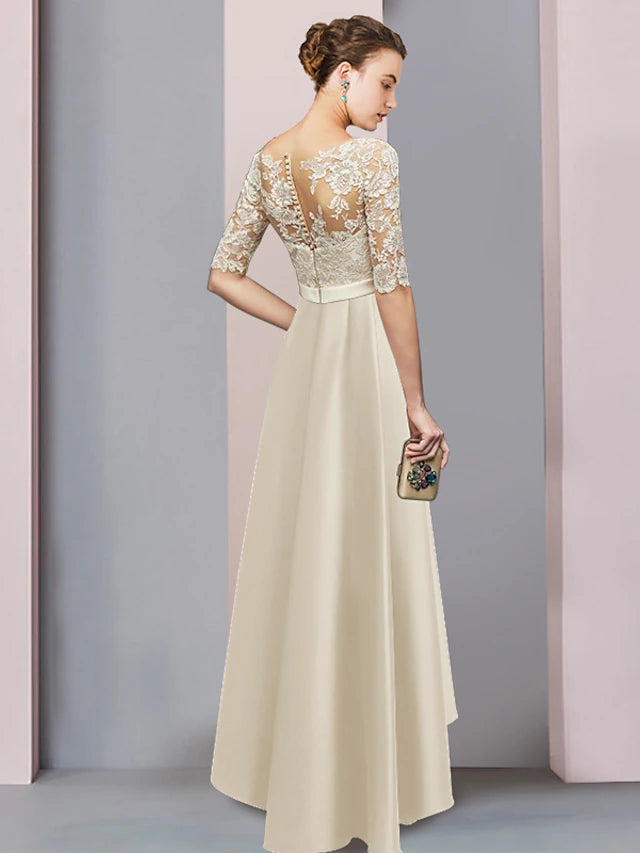 High-low tea length hem of a satin and lace formal dress.