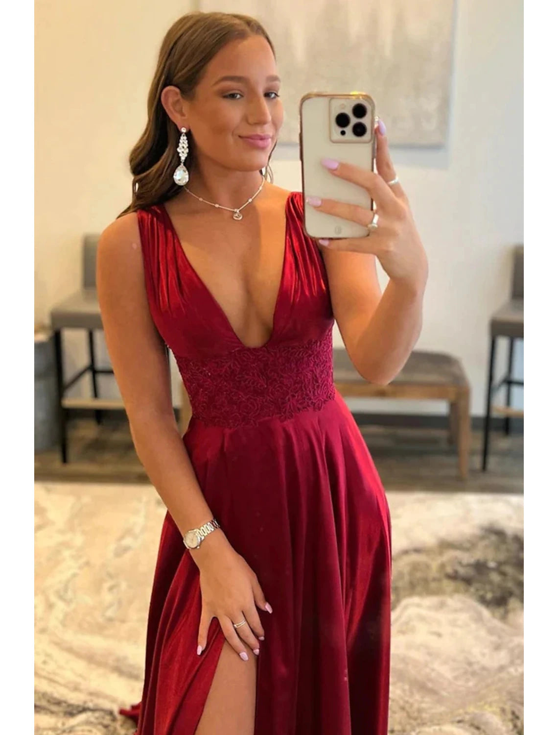 Model wearing an elegant A-line scoop neck prom dress with lace details and a front slit.