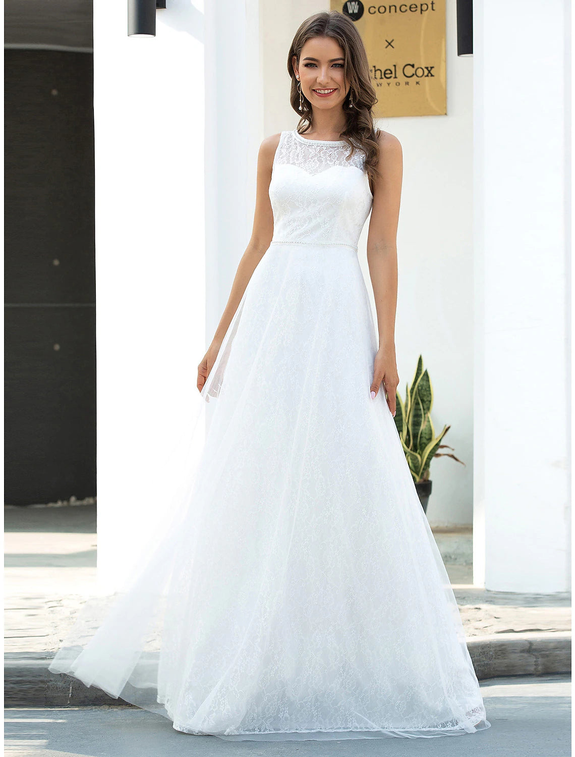 Elegant A-line lace beach wedding dress with scoop neck.