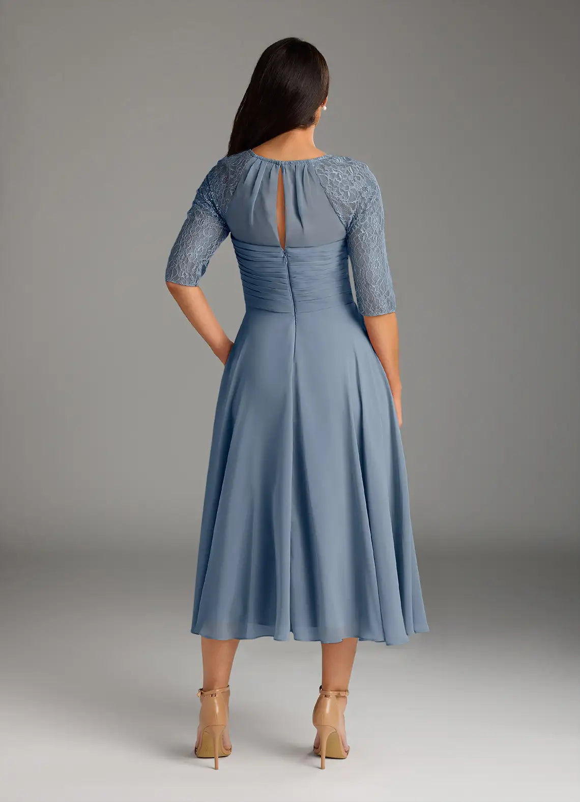 Back view of A-line formal gown with lace details.