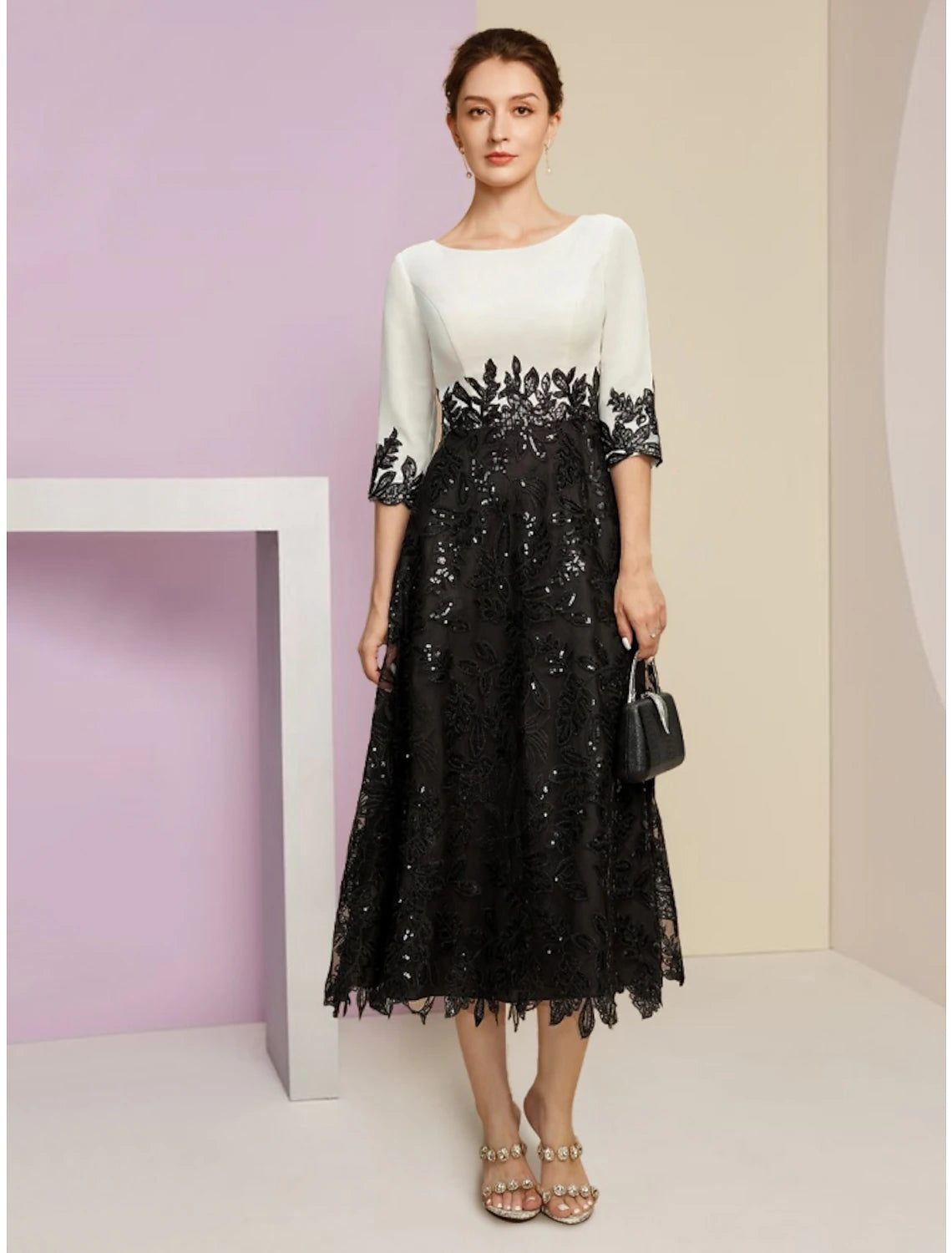Elegant A-line tea-length dress with scoop neck, half sleeves, lace, and sequin details.
