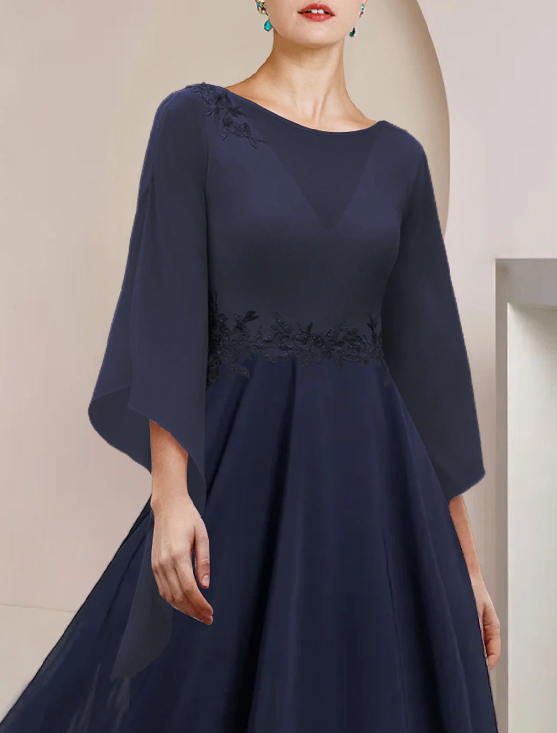 Side profile of the tea length A-Line dress, suitable for wedding guests.