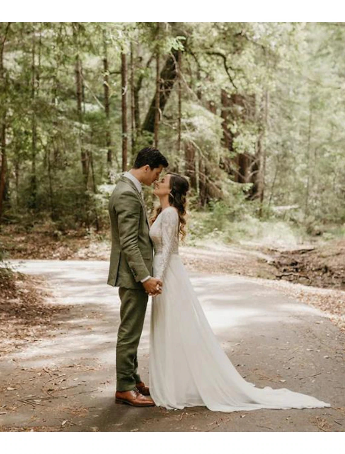 Boho A-line wedding dress with scoop neck, long sleeves, and open back, featuring lace details.