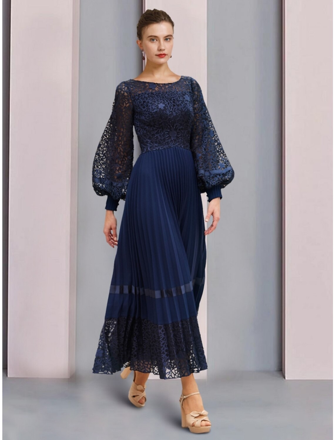 Elegant A-line mother of the bride dress with scoop neck and long sleeves.