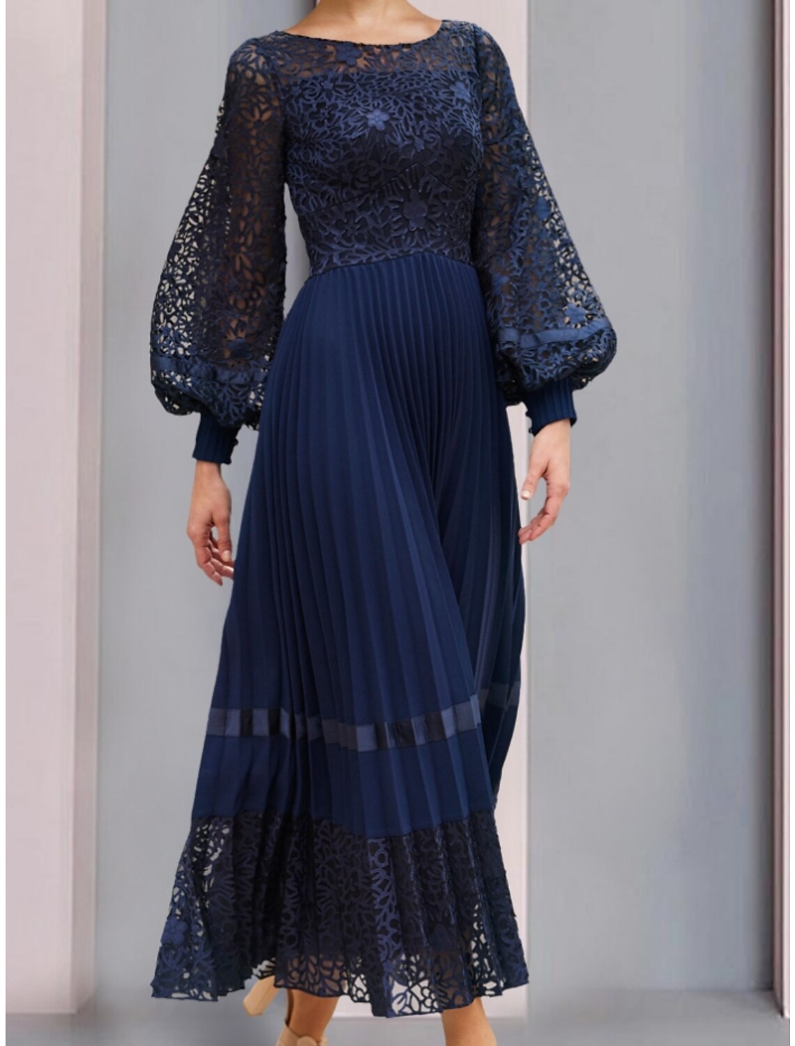 Back view of the A-line chiffon lace gown, showing ruching detail.