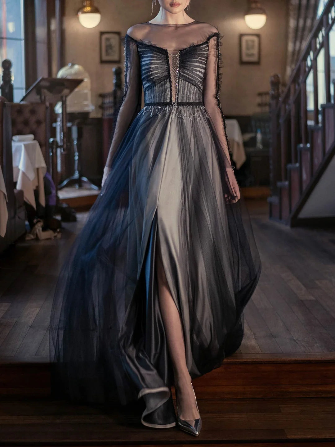 Elegant A-line scoop neck long sleeve floor-length evening dress on a model.