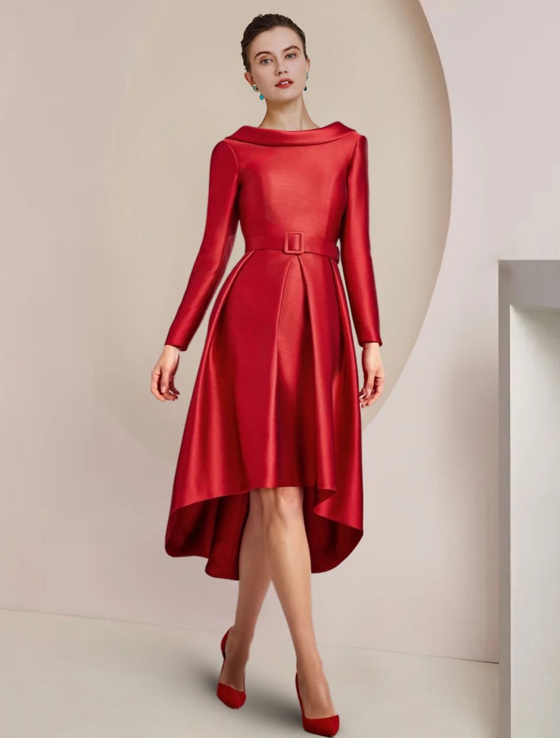 Side view of the high-low asymmetrical satin dress with a crystal brooch.