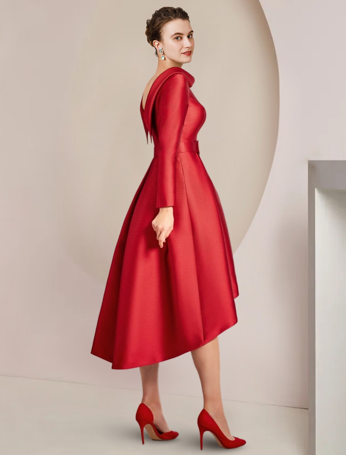 Model showcasing the flowing silhouette of the A-line high-low dress.
