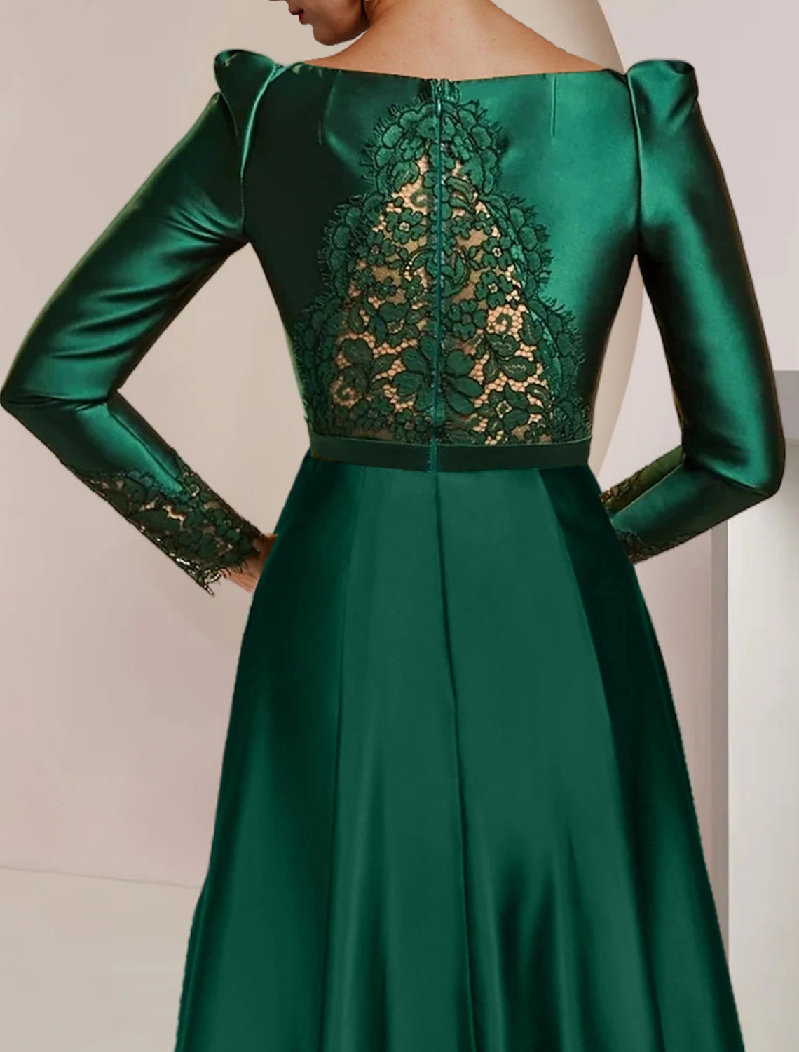 Back view of the tea-length satin lace dress with high-low hem.