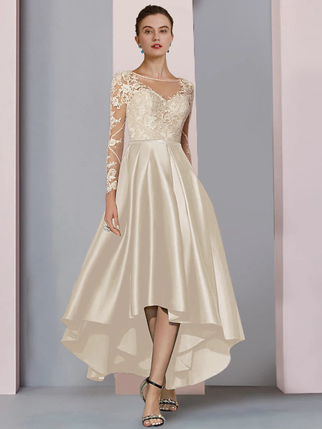 Elegant A-Line tea length dress with high-low hem and long sleeves.