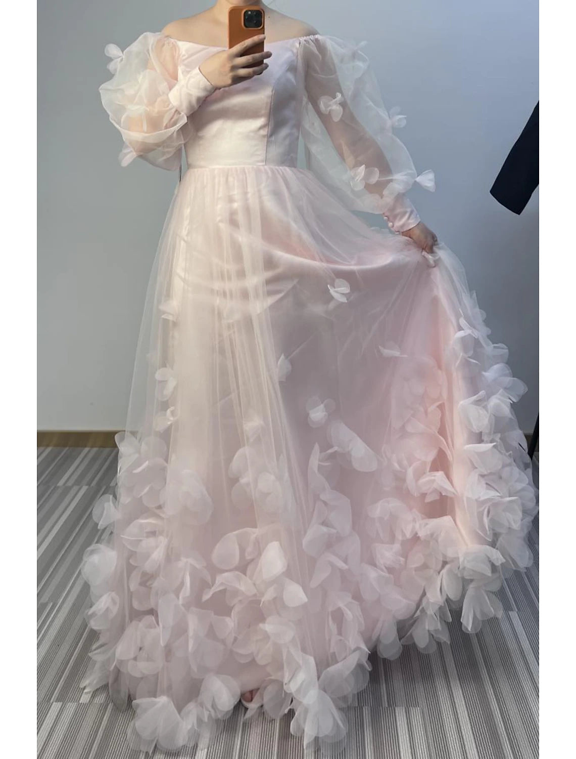 Side view of the floor-length A-line gown, showcasing the flowing tulle skirt.