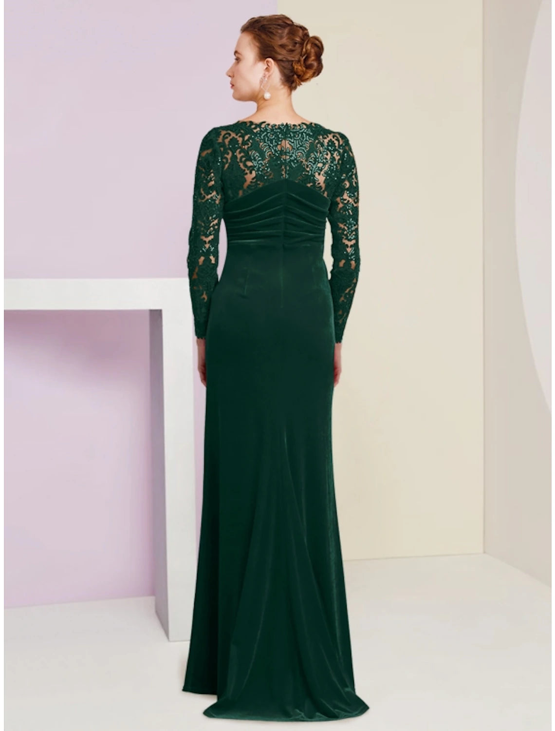 Back view of a formal A-Line dress with long sleeves.