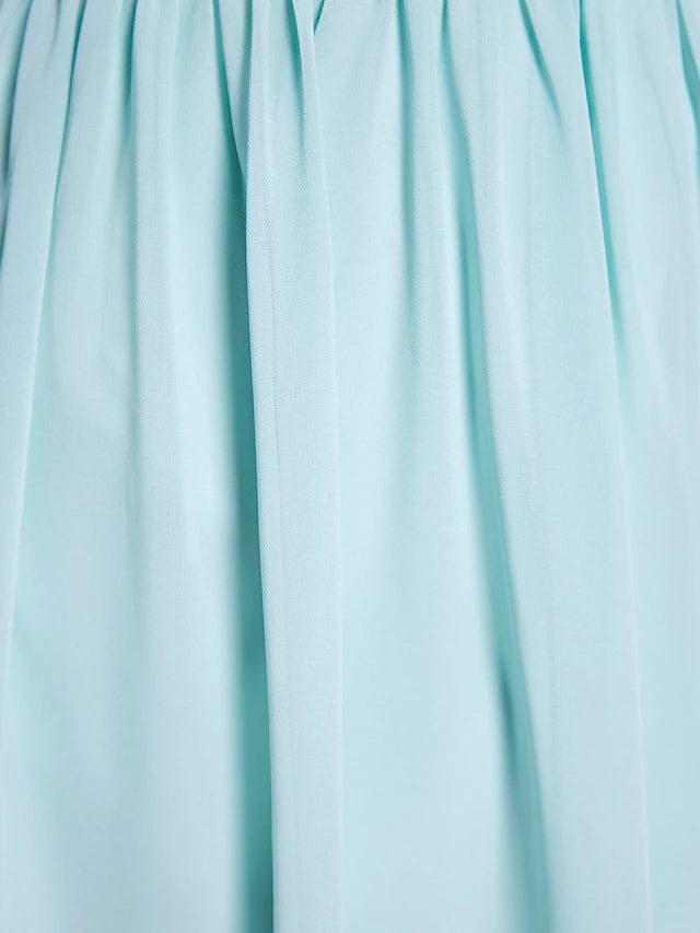 Close-up of ruched and draped detail on A-Line dress.