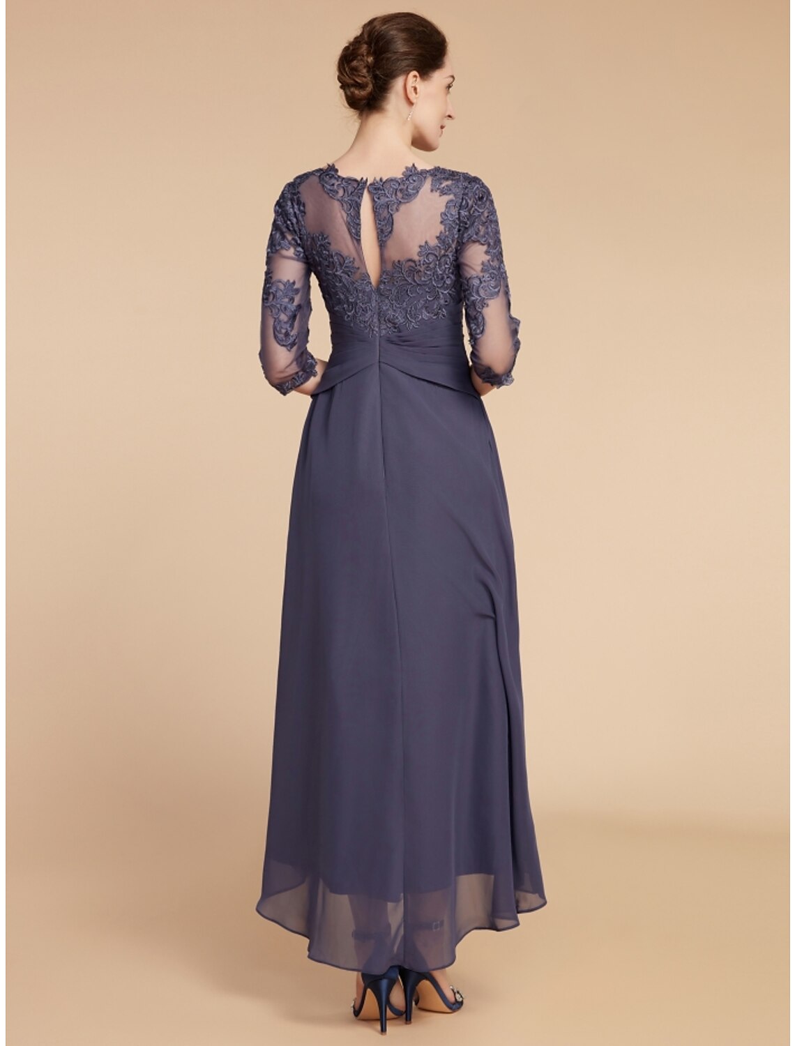 Back view of the A-line chiffon and lace dress with ruching.