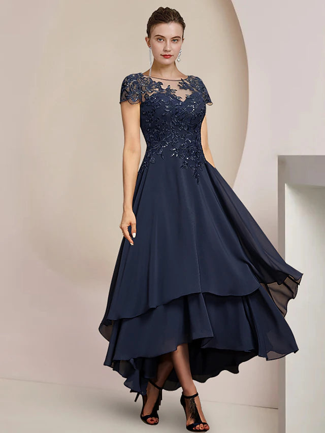 Elegant A-line mother of the bride dress with scoop neck and short sleeves, featuring sequin appliques on chiffon and lace.