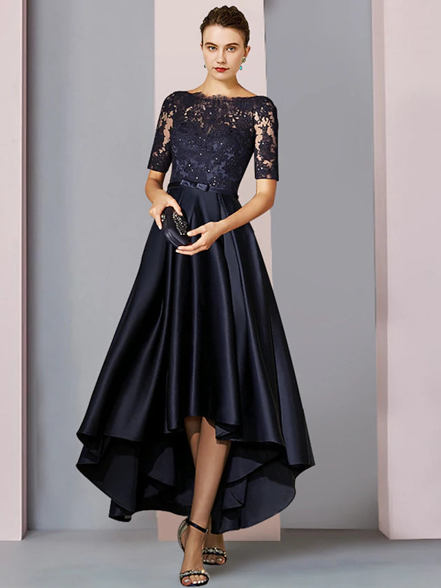 Elegant A-line mother of the bride dress with scoop neck, short sleeves, and high-low tea length hem.