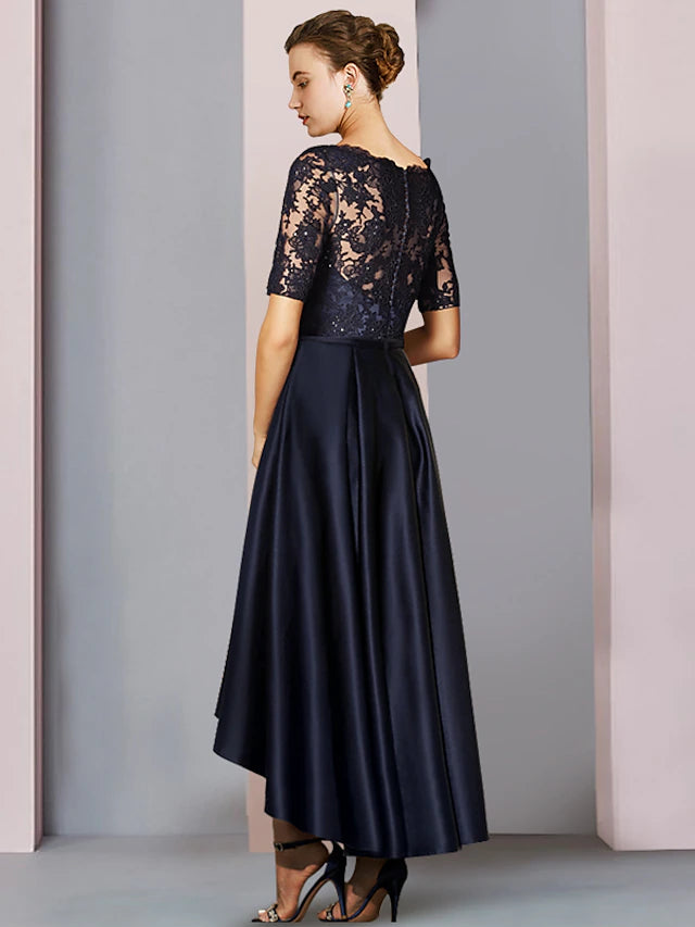 Back view of an elegant satin lace dress featuring pleats and appliques.
