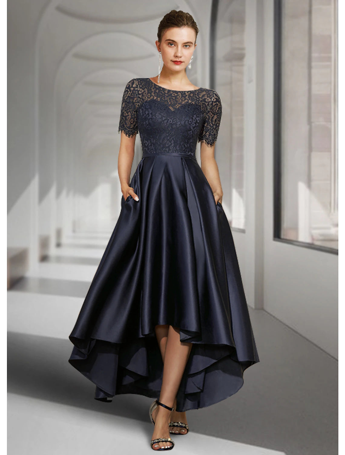 Elegant A-line high-low tea length dress with scoop neck and short sleeves, front view.