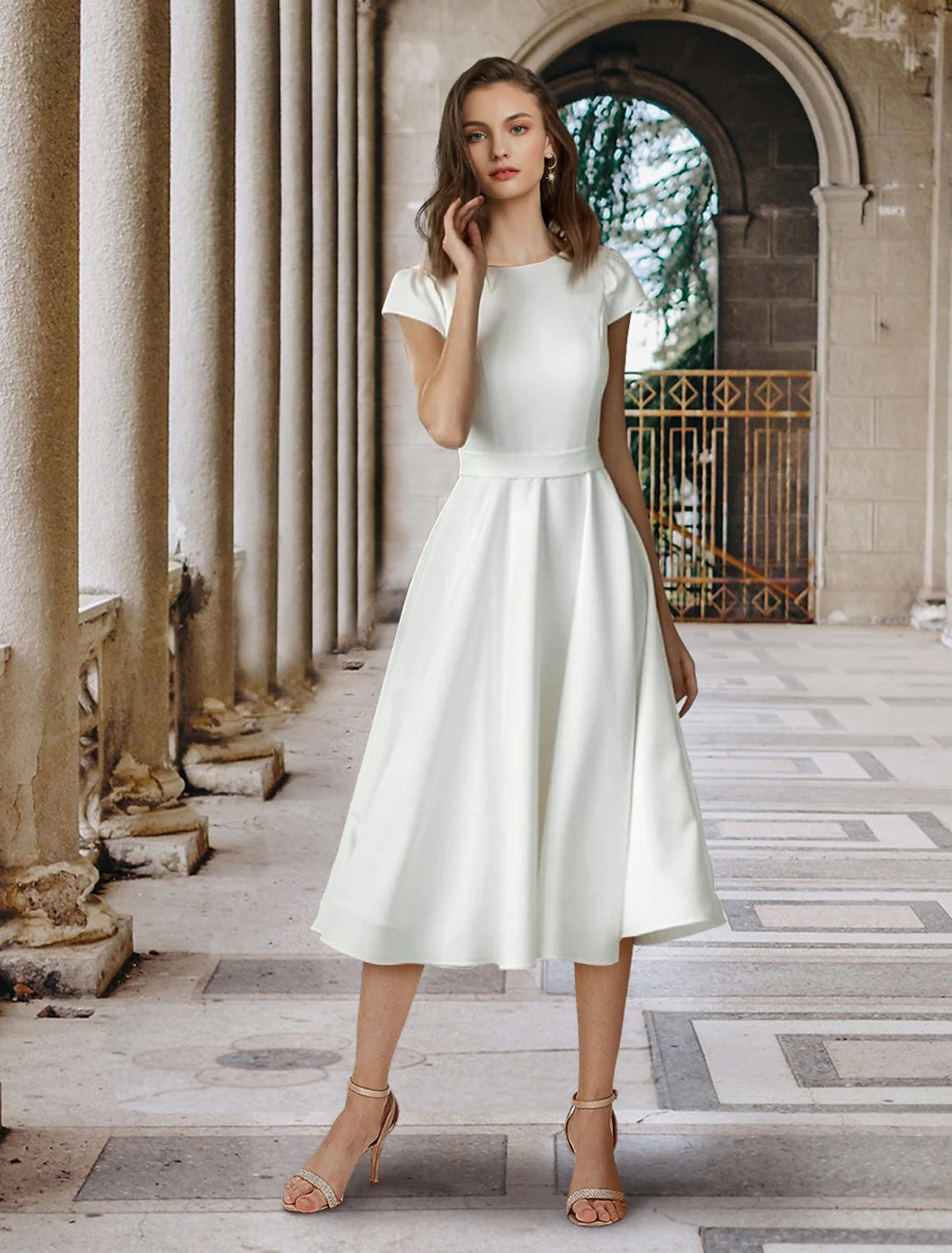 White A-line wedding dress with scoop neck, short sleeves, and pleated satin detail.
