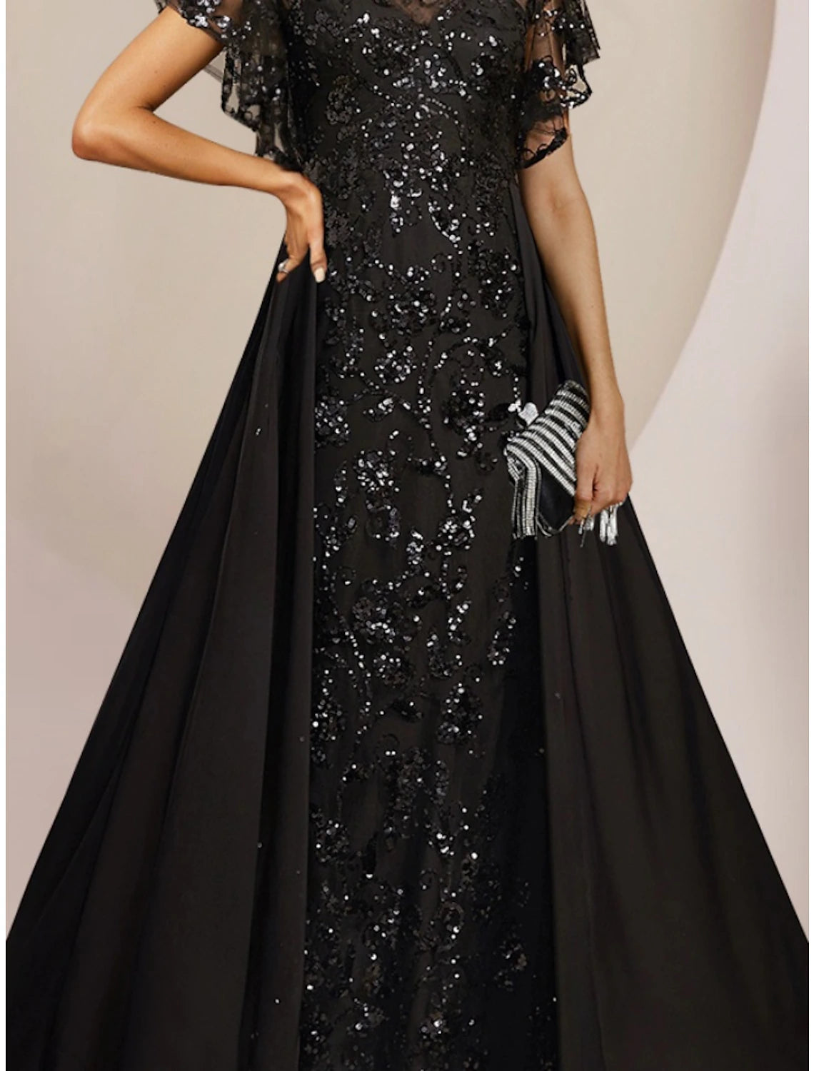 Back view of the A-Line Mother of the Bride dress, showing floor length skirt and sequin details.