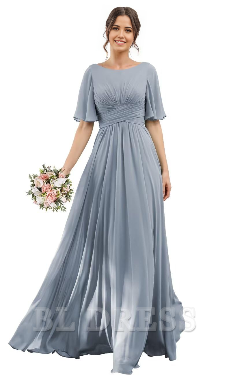 Full length view of a woman in a sleeveless A-line chiffon prom dress.