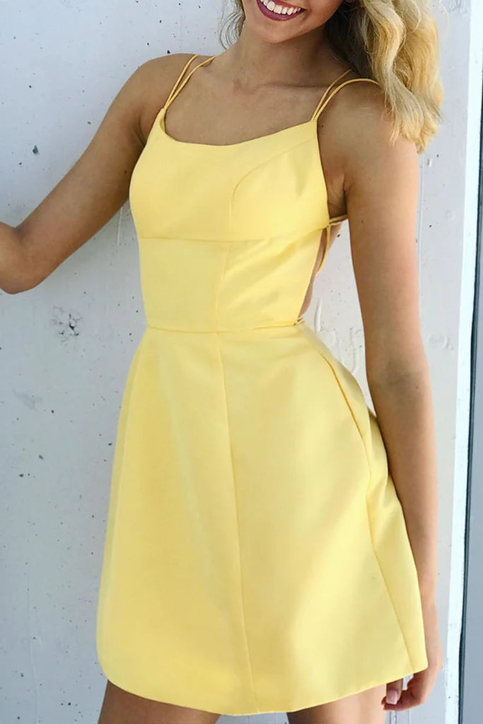 Elegant A-line maxi dress with scoop neck and spaghetti straps.