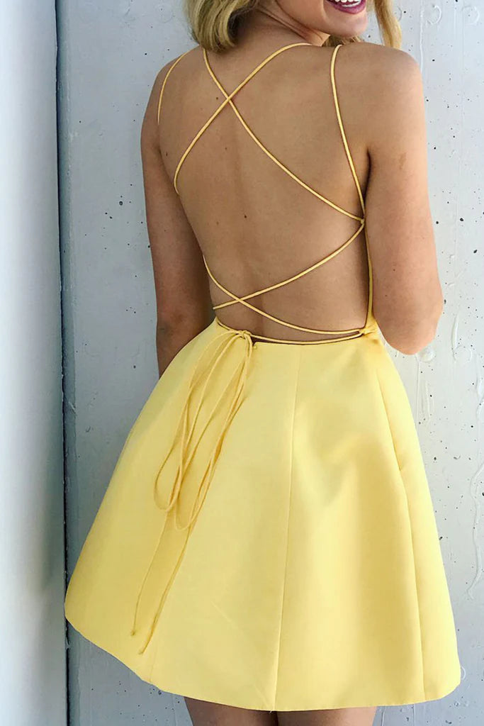 Back view of a flowing A-line prom dress with delicate straps.