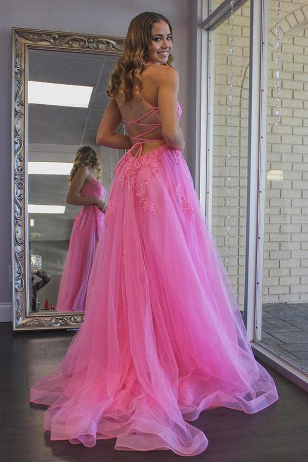 Back view of hot pink A-line evening dress with flowing tulle skirt.