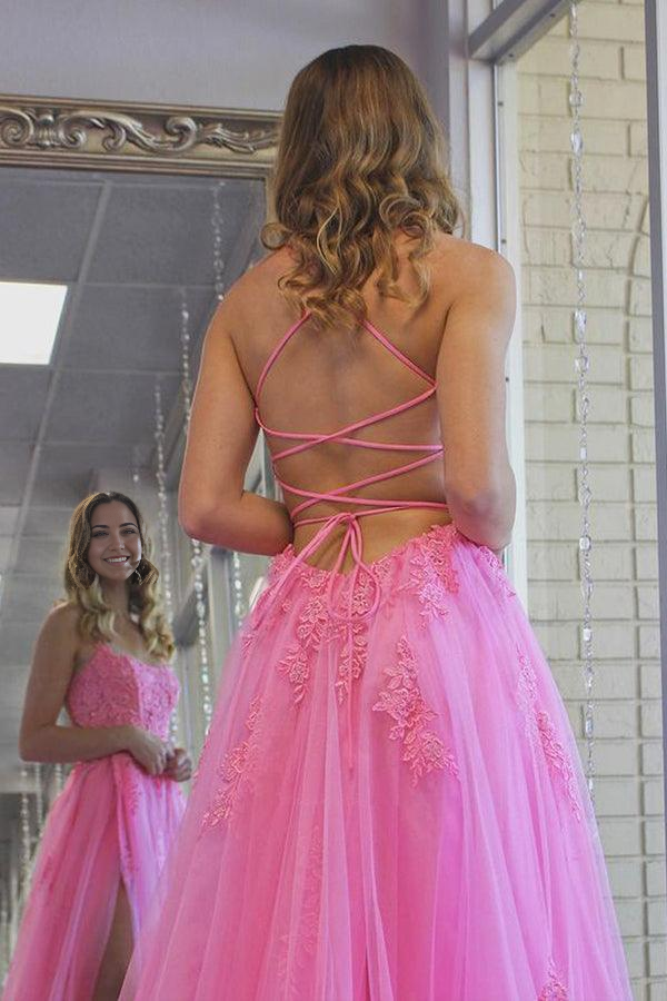 Side view of hot pink formal dress, highlighting the scoop neckline and split.