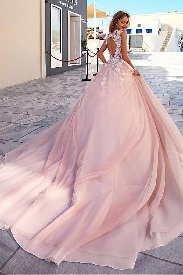 Back view of a romantic A-line wedding gown in white tulle.