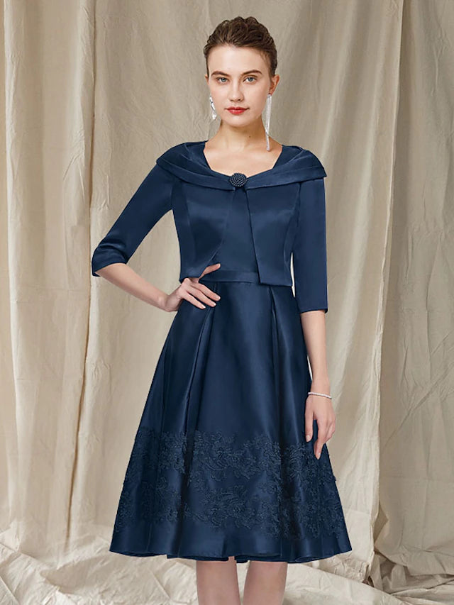 Back view of the A-line Mother of the Bride dress showing lace details.