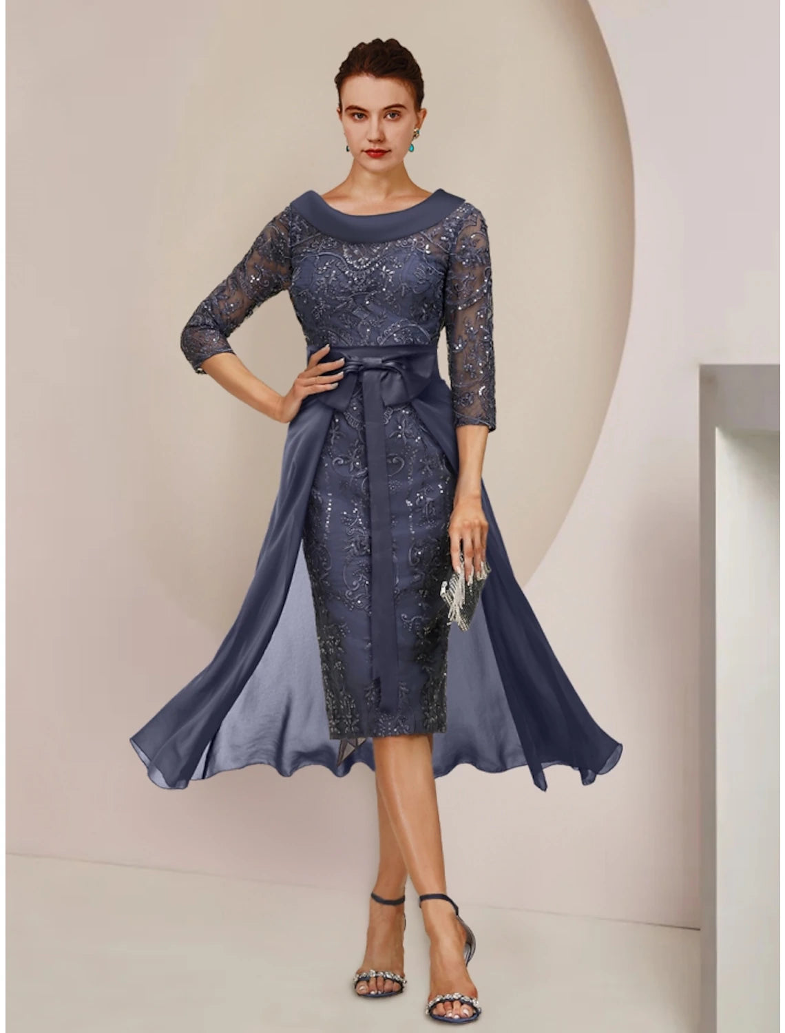 Elegant A-line Mother of the Bride dress featuring a scoop neck, 3/4 sleeves, sequin details, and knee-length.